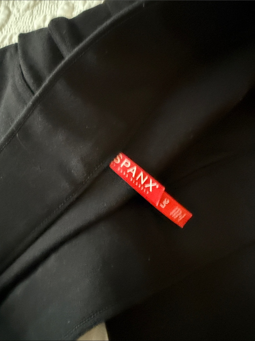 SPANX Black women’s point Pants with Red Branding Tab